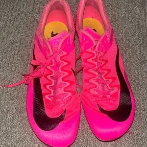 Hot pink Nike sprint cleats